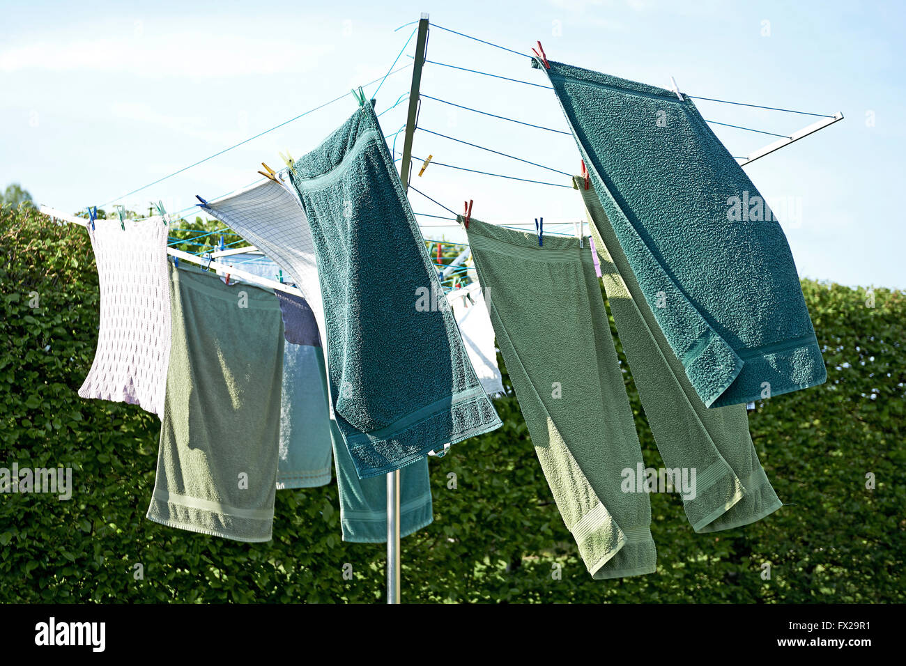 Drying laundry outside in the wind Stock Photo
