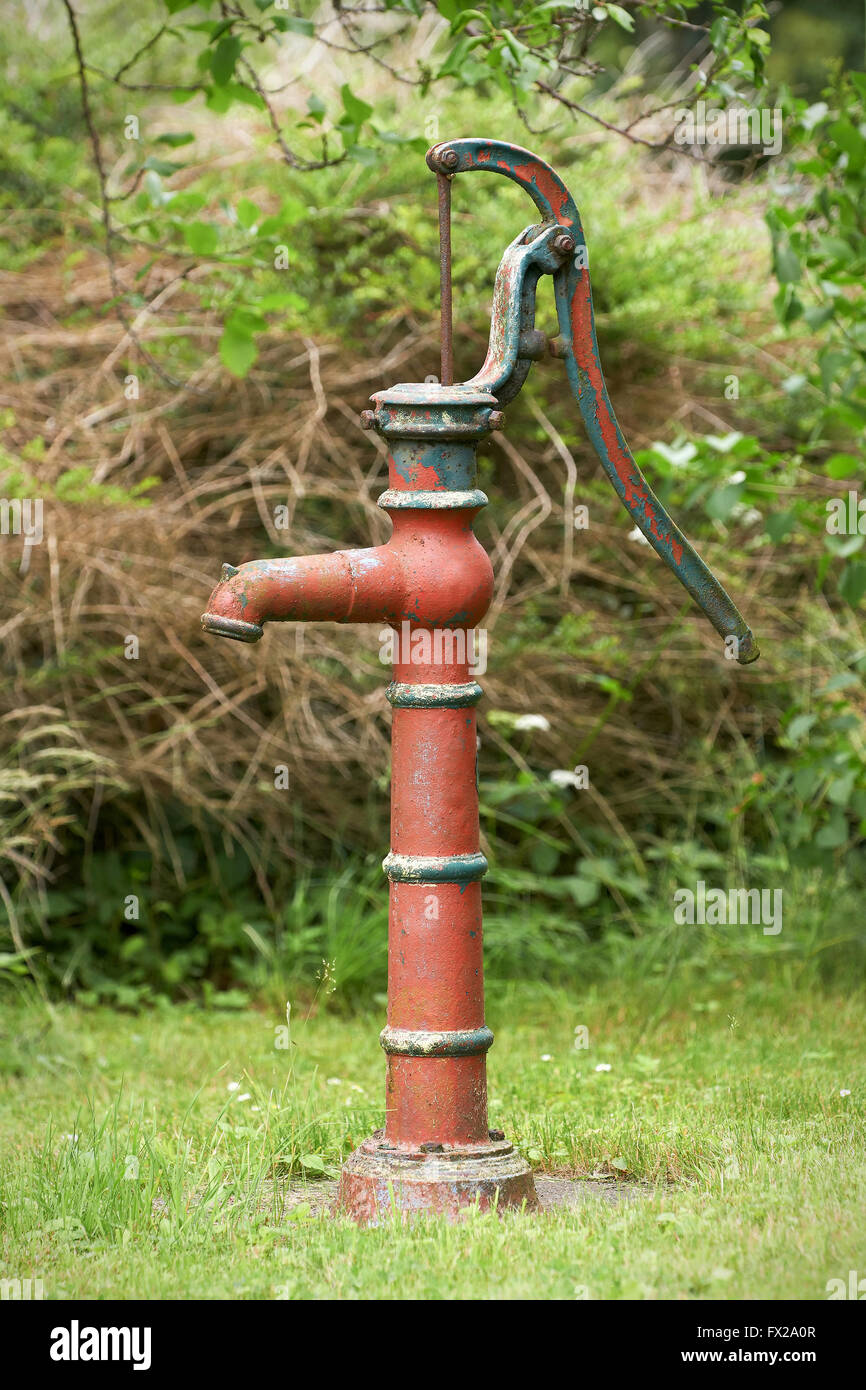 Old and rusty cast iron water well hand pump Stock Photo - Alamy