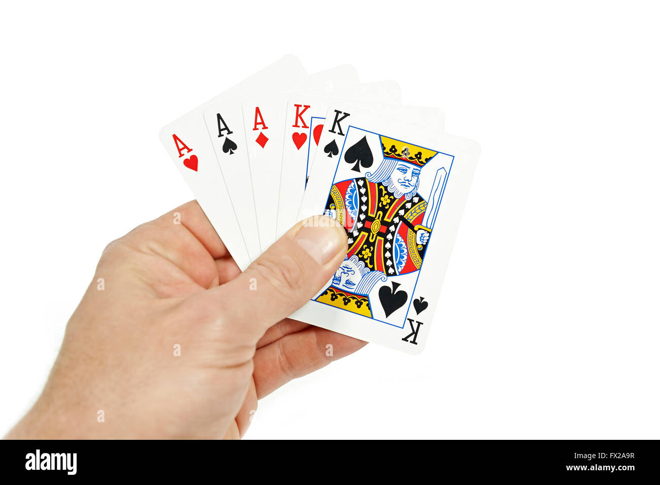 The hand of a Poker player holding full house Stock Photo