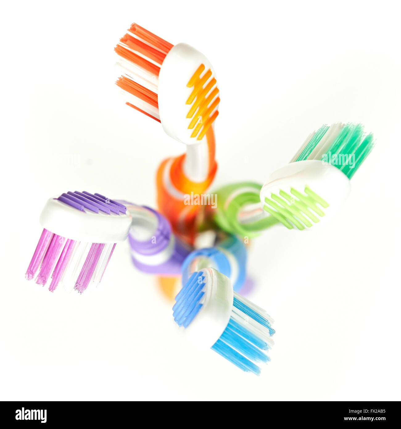 Colorful toothbrushes isolated on white Stock Photo