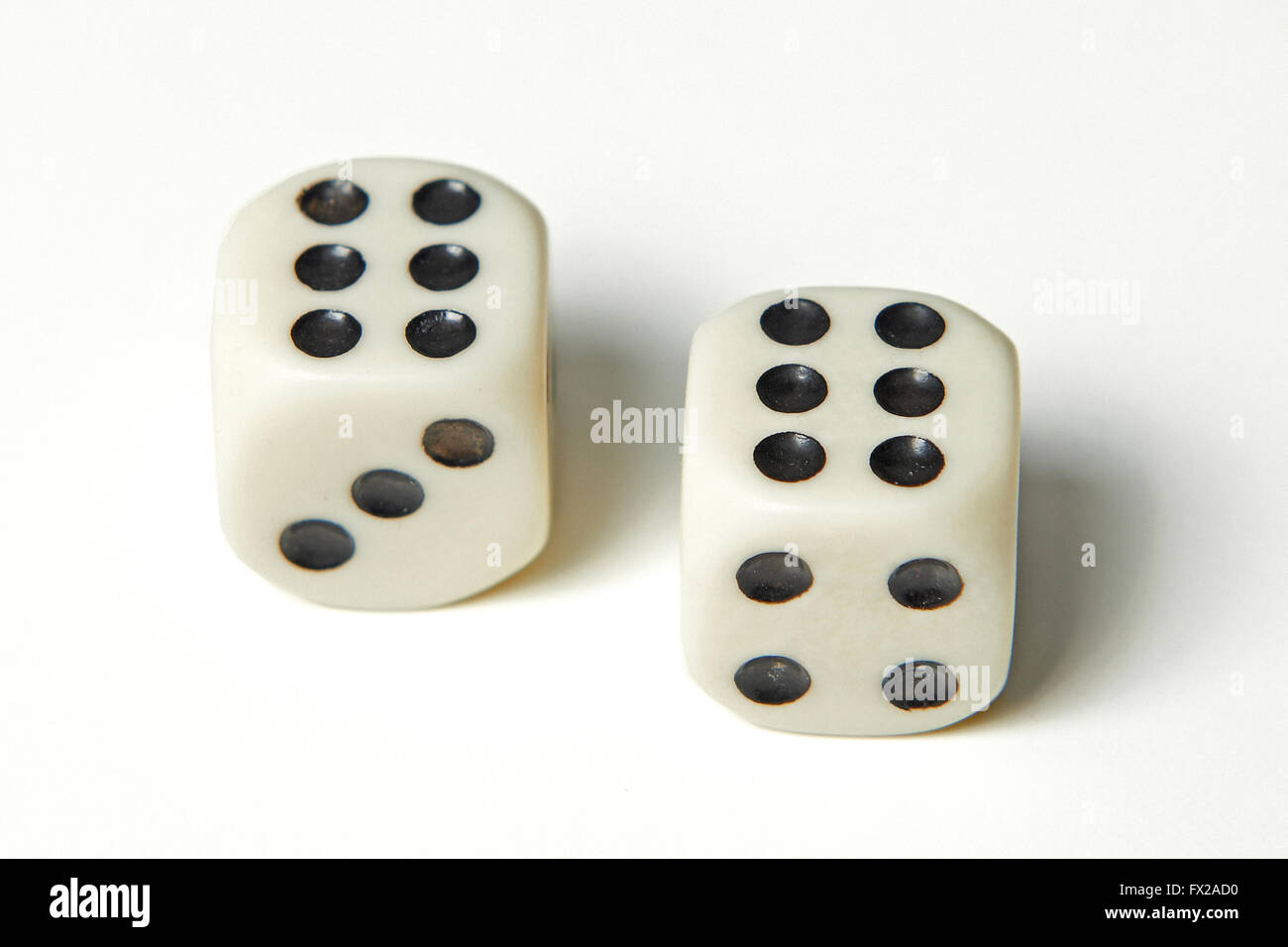 Pair of thrown dices showing two sixes Stock Photo