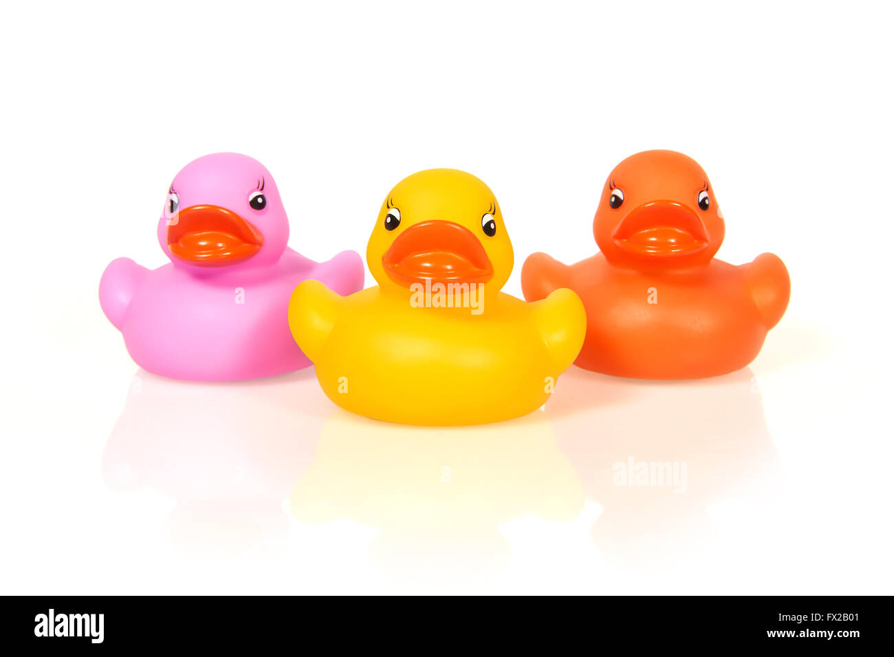 Colorful rubber ducks with big lips on a white background Stock Photo