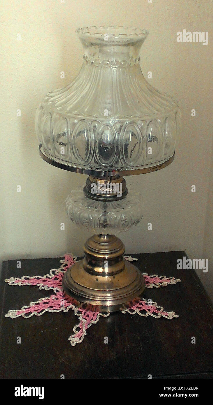 Clear glass gas light lamp on table Stock Photo