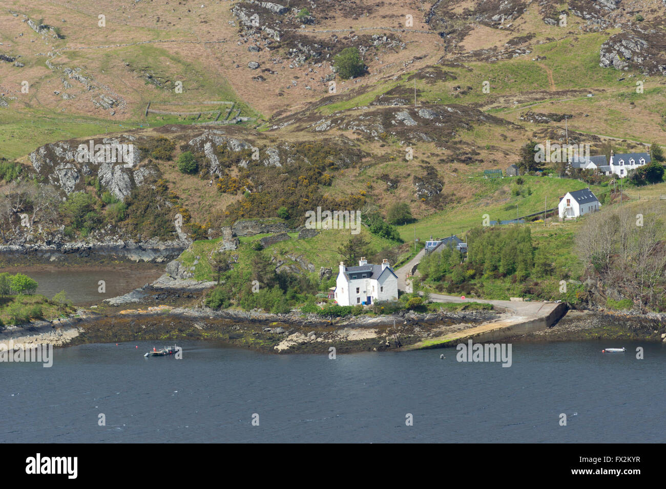 Traditional house and pier at Strome Ferry, Loch Carron, Rossshire, on
