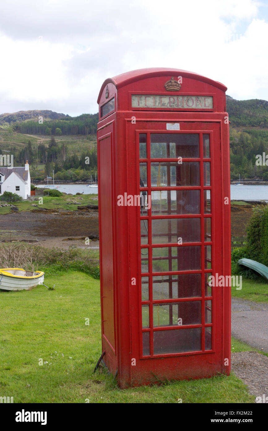 Red telephone box in Plockton, in Ross and Cromarty, in the Highlands of Scotland Stock Photo