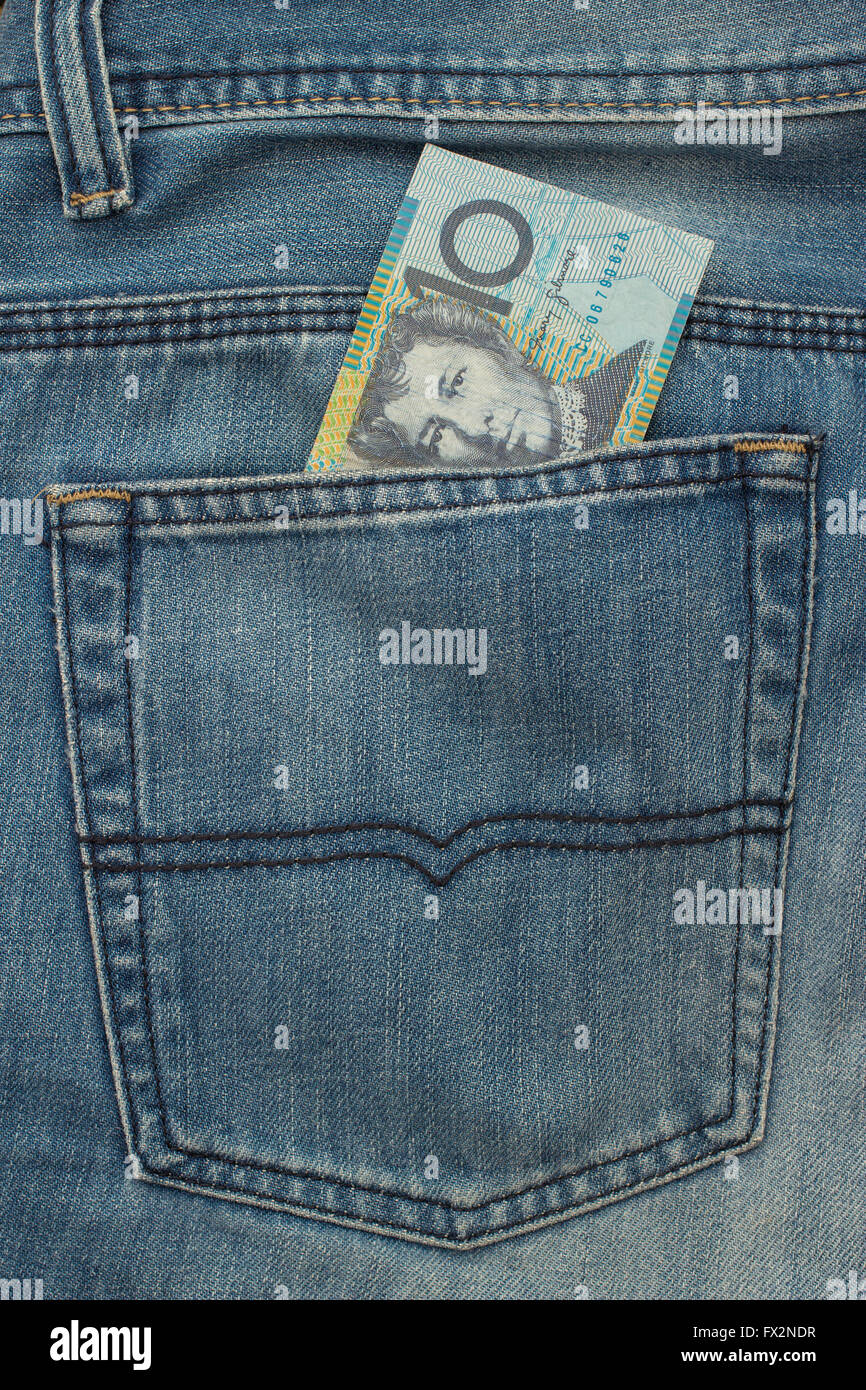 10 Australian dollar Banknote in back pocket of blue jeanse Stock Photo