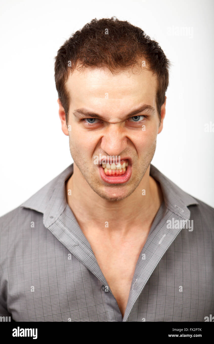 Face of angry evil man. Scary person studio portrait Stock Photo
