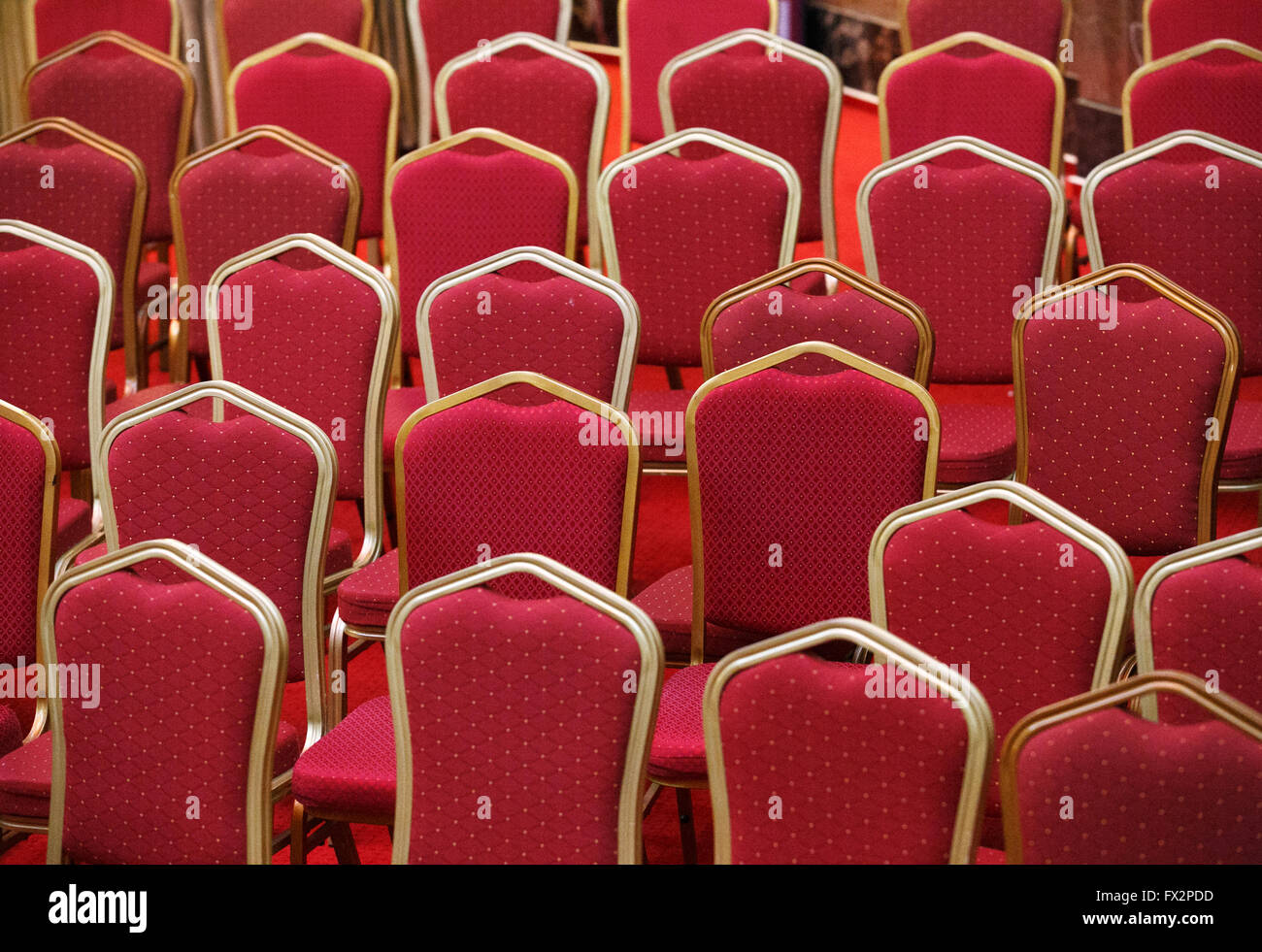 Rows of empty red seats in theater or cinema hall Stock Photo