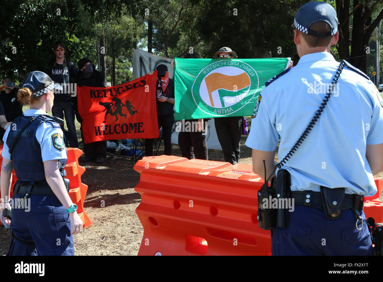 Sydney, Australia. 10 April 2016. Pictured: Counter protesters from Antifa. The Australian Party for Freedom held a rally opposing the ‘Halal Expo 2016’ at the entrance to the Fairfield Showground. They say that the Halal Expo is a manifestation of multicultural madness promoting halal products and sharia law in Australia. They called upon the Australian federal government to ban ritual slaughter in Australia. They also wanted to create awareness and highlight the dangers sharia law poses to the Australian way of life. Credit:  Richard Milnes/Alamy Live News Stock Photo