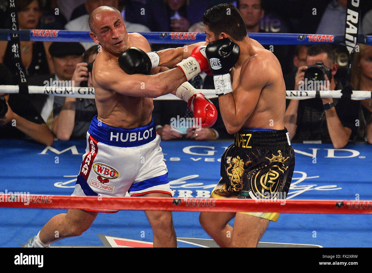 Las Vegas, Nevada, USA. 9th April, 2016. Arthur Abraham (L) (Berlin,  Germany) and Gilberto Ramirez (Mazatlan, Mexico) throw punches during the Abraham  vs. Ramirez WBO Super Middleweight World Championship fight in the