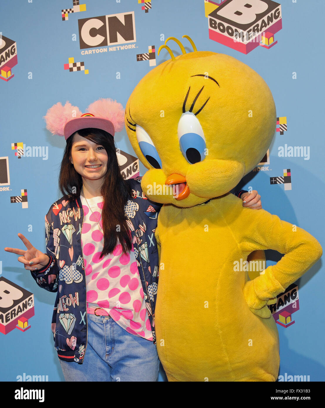 Munich, Germany. 10th Apr, 2016. German singer Jamie-Lee Kriewitz (L) poses next to cartoon character Tweety upon her arrival at Fun Day, the celebrations marking the 10th anniversary of the children's and cartoon television channel Cartoon Network and Boomerang, at TonHalle in Munich, Germany, 10 April 2016. Kriewitz is to represent Germany in the upcoming Eurovision Song Contest to be held in Stockholm, Sweden. Photo: URSULA DUEREN/dpa/Alamy Live News Stock Photo
