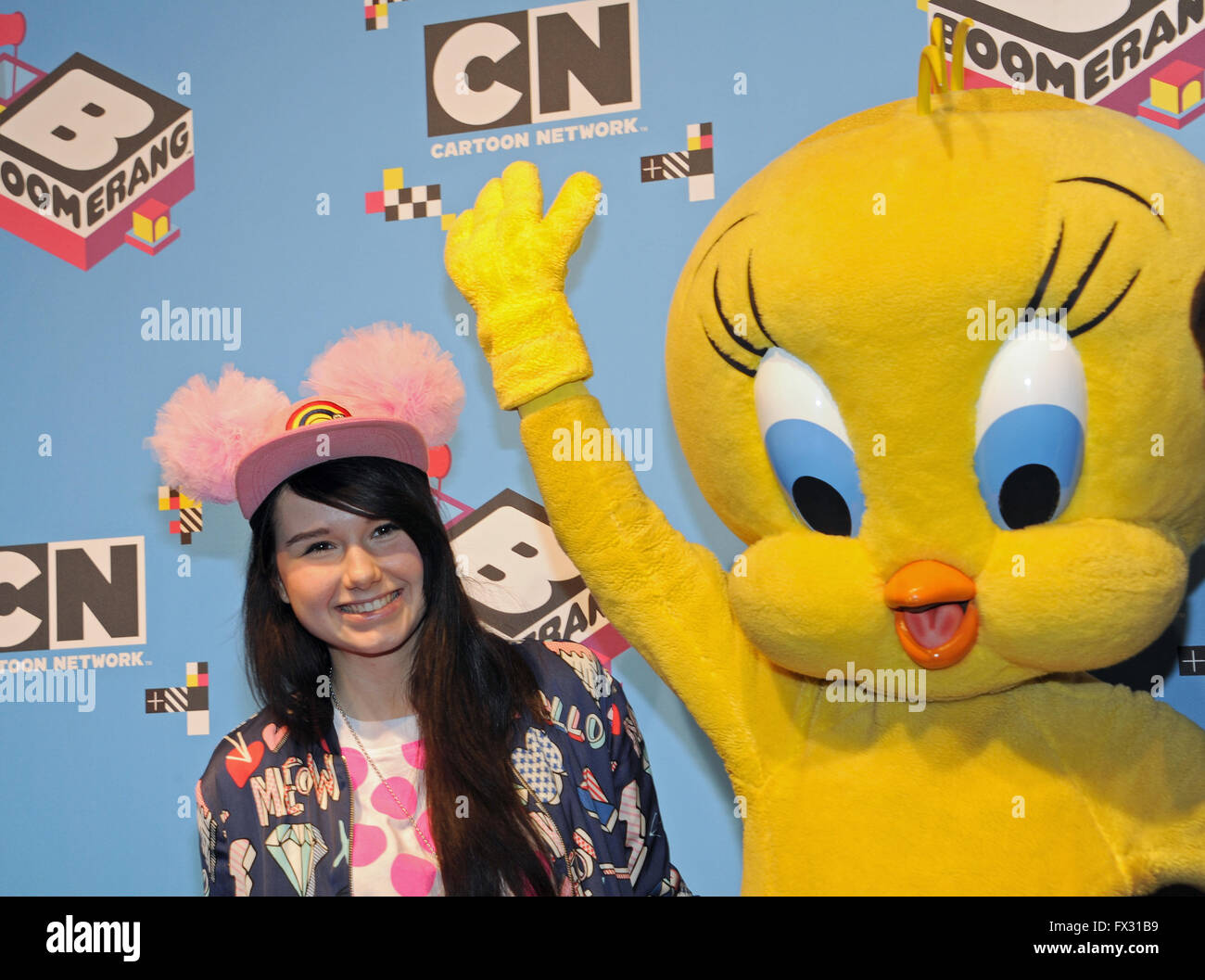 Munich, Germany. 10th Apr, 2016. German singer Jamie-Lee Kriewitz (L) poses next to cartoon character Tweety upon her arrival at Fun Day, the celebrations marking the 10th anniversary of the children's and cartoon television channel Cartoon Network and Boomerang, at TonHalle in Munich, Germany, 10 April 2016. Kriewitz is to represent Germany in the upcoming Eurovision Song Contest to be held in Stockholm, Sweden. Photo: URSULA DUEREN/dpa/Alamy Live News Stock Photo