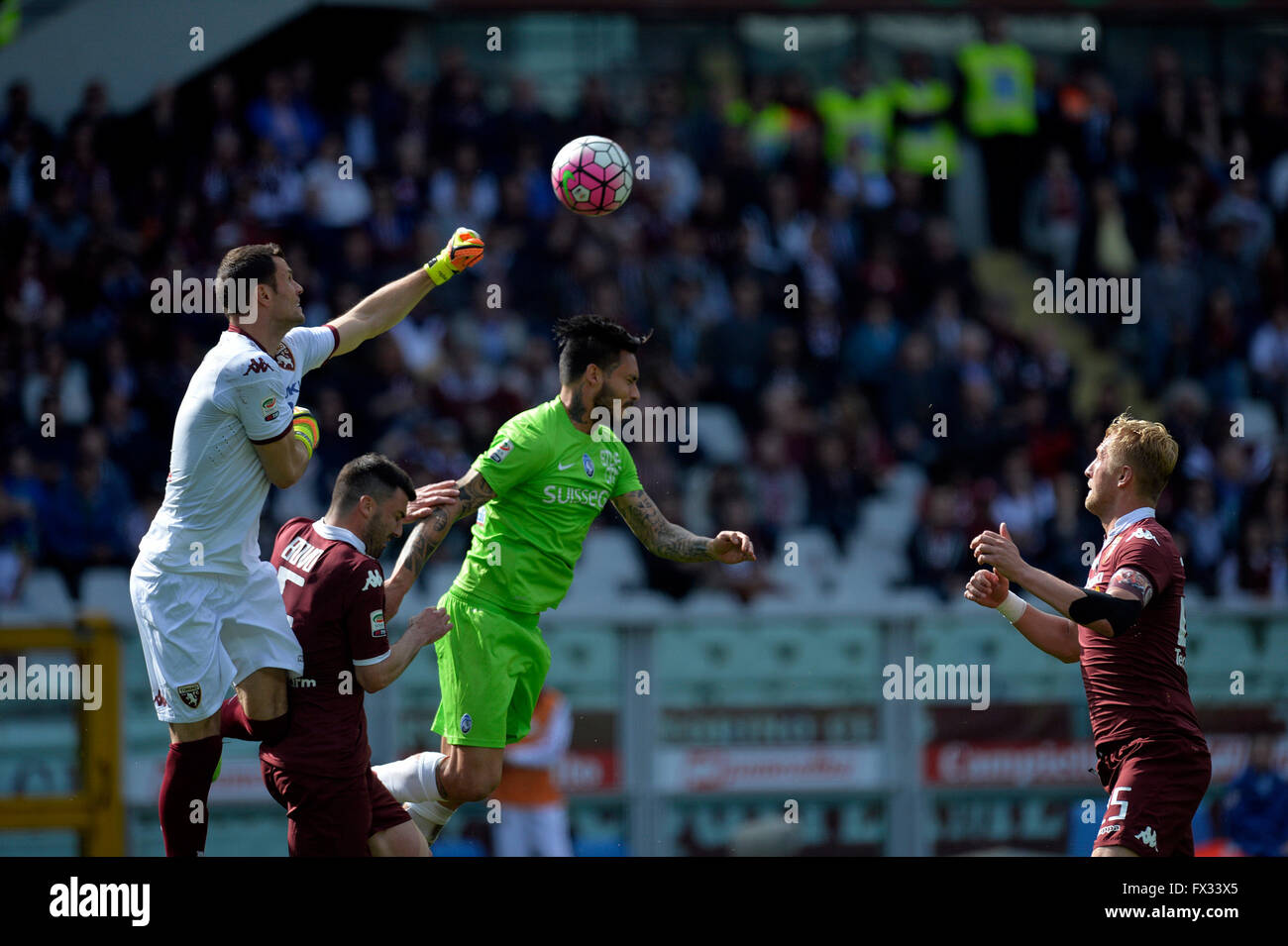 Turin, Italy. 10th April, 2016. Serie A Football. Torino versus Atalanta. Daniele Padelli punches clear from Mauricio Pinilla Credit:  Action Plus Sports Images/Alamy Live News Stock Photo
