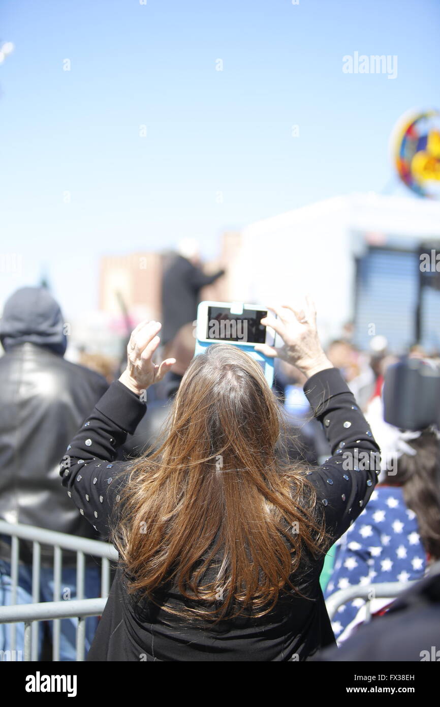New York City, United States. 10th Apr, 2016. Jane O'Meara Sanders takes picture of candidate during his stump speech. Democratic presidential candidate Bernie Sanders addressed supporters on the Coney Island boardwalk, sharing remarks before stopping at Nathan's Famous for a hot dog Credit:  Andy Katz/Pacific Press/Alamy Live News Stock Photo