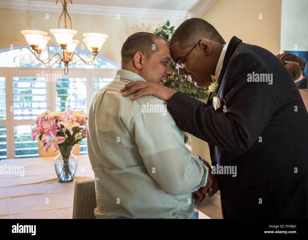 West Palm Beach, Florida, USA. 10th Apr, 2016. Tony Ramilo talks with his son, Jonathan, for a moment before he heads off to prom in a stretch limo. © Allen Eyestone/The Palm Beach Post/ZUMA Wire/Alamy Live News Stock Photo