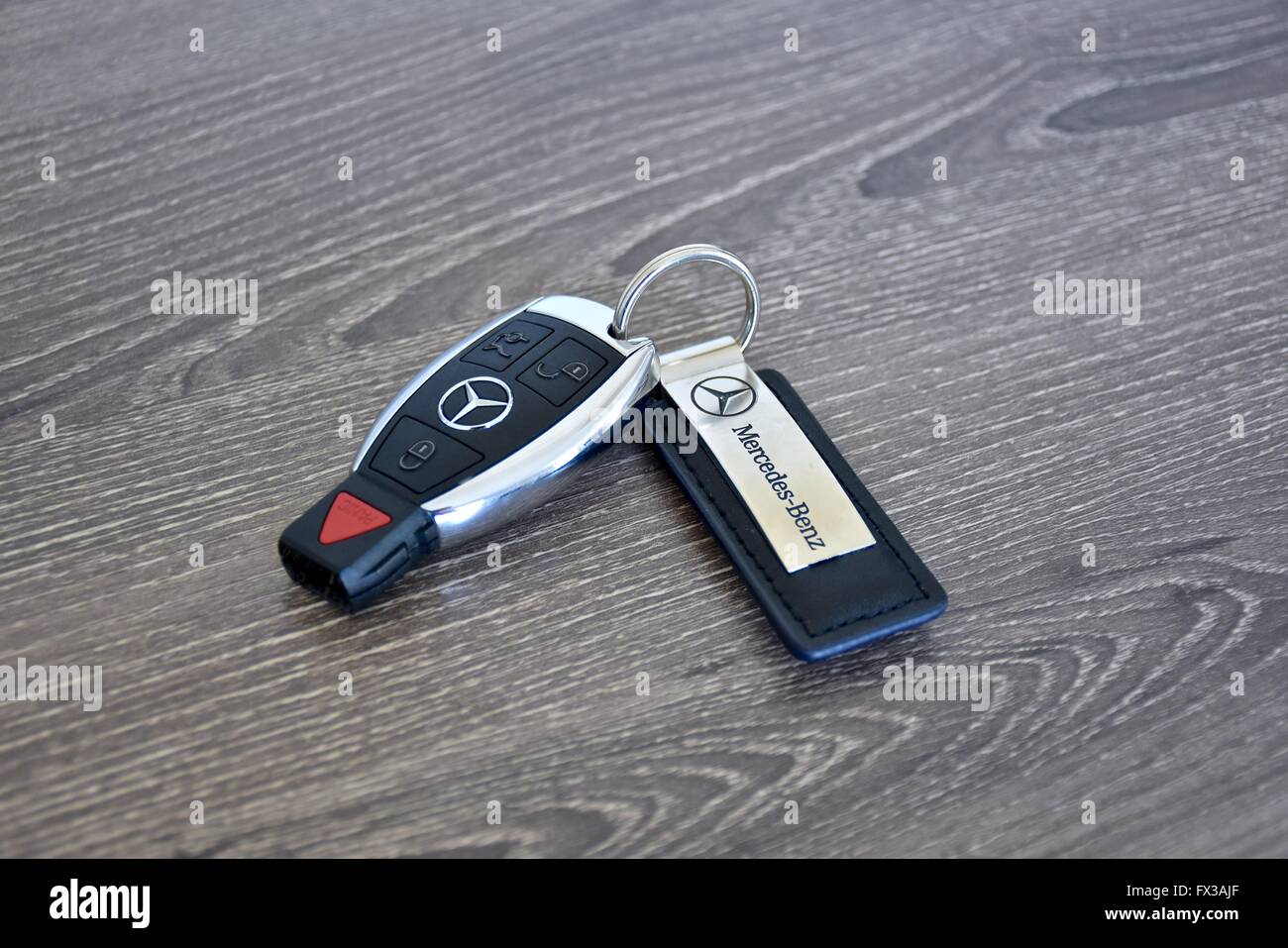 A Mercedes-Benz key fob laying on a wood surface Stock Photo - Alamy