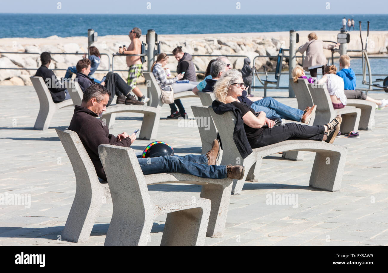 Barceloneta promenade with concrete chairs and exercise machines and  Barceloneta Beach in Barcelona, Catalonia, Spain Stock Photo - Alamy