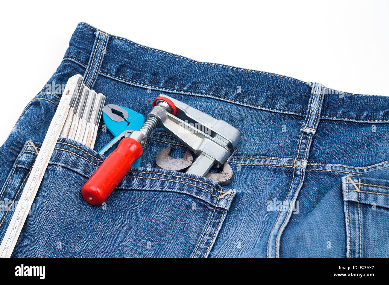 Image shows several tools in a jeans pocket Stock Photo