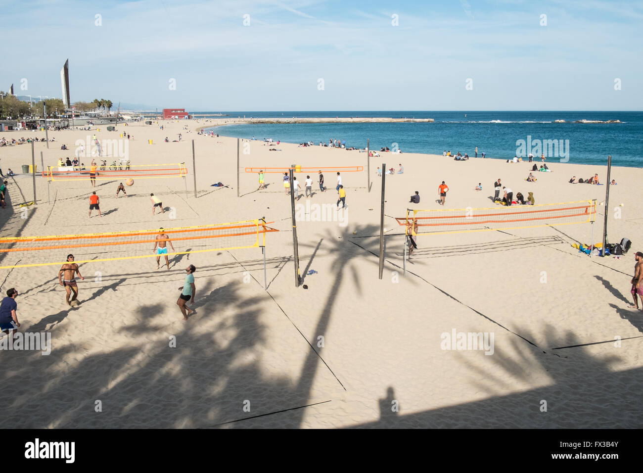 Playing Beach Volleyball on sandy sand at Playa,Plage, Nova Icaria Beach, Barcelona,Catalonia,Spain,Europe. Stock Photo