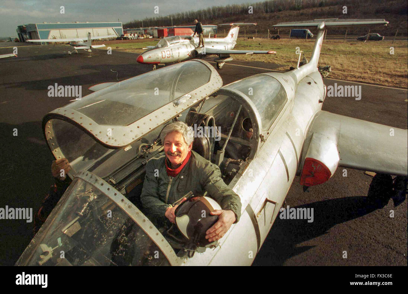 Glasgow man, Geoff Rosenbloom, with some of the old Soviet Jet aircraft he imported from the Soviet Block at Cumbernauld airport Stock Photo