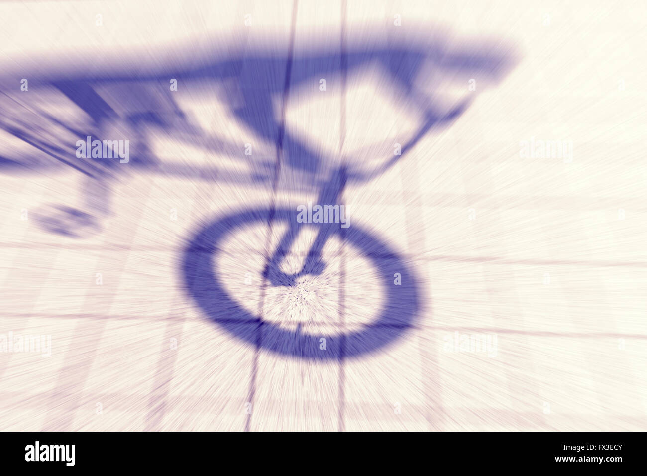 Retro toned motion blurred shadow of a teenager riding a bmx bike. Stock Photo