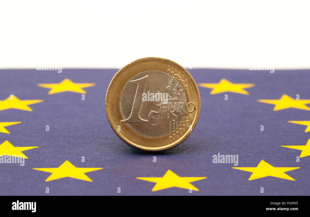 An Euro standing on an European flag Stock Photo