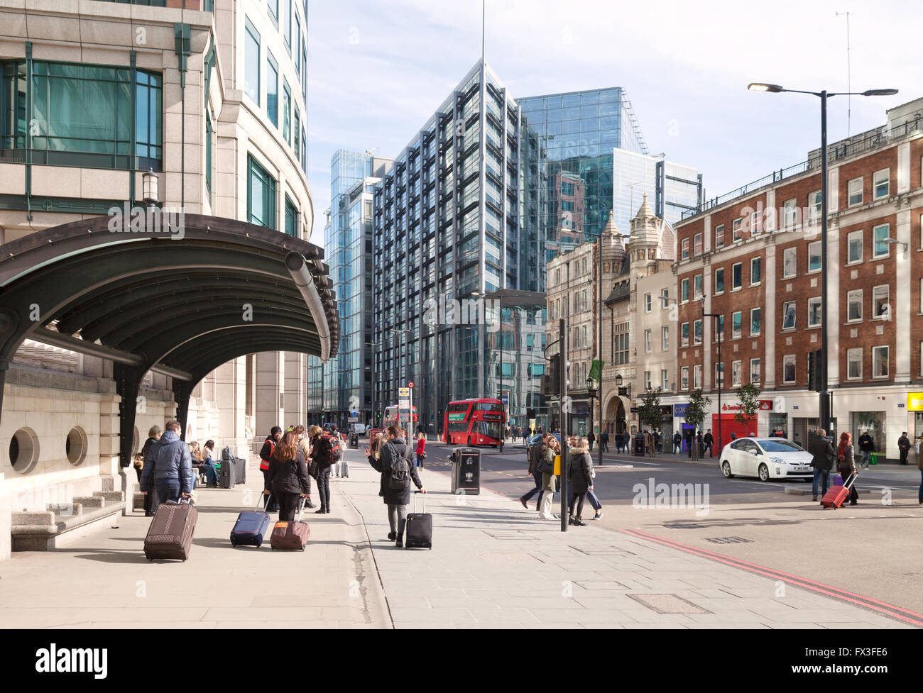 People in Bishopsgate, City of London street scene, looking towards the RBS building, Spitalfields East London UK Stock Photo