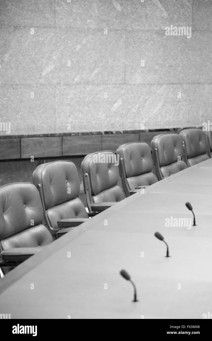 Empty seats at a board room table. Stock Photo