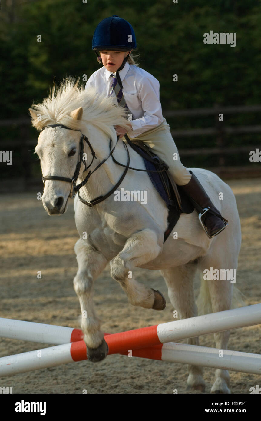 Pony Club meeting in Devonshire with help from olympic equestrian Mary King,where young girls practice show jumping and dressage. Stock Photo