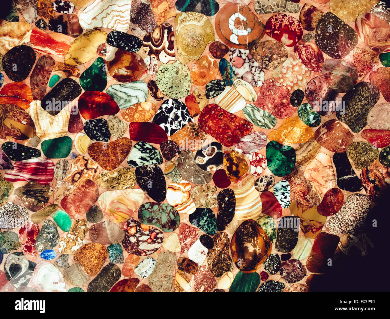 Many colored stones on a table. Stock Photo