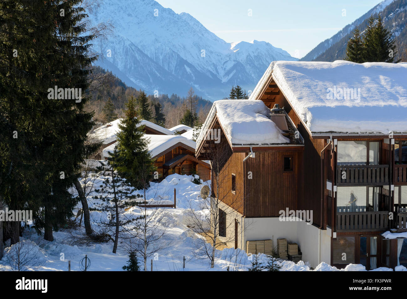 Winter ski chalet and cabin in snow mountain landscape Stock Photo - Alamy