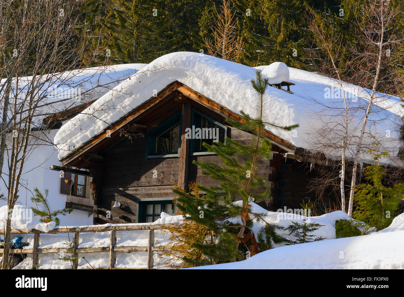 Winter ski chalet and cabin in snow mountain landscape Stock Photo - Alamy