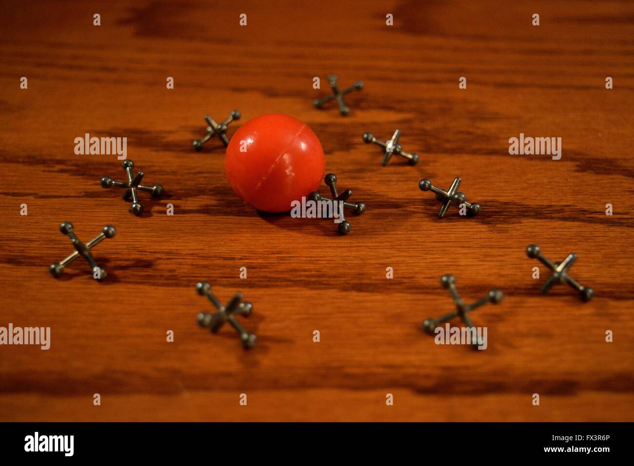 Playing jacks on a table. Stock Photo