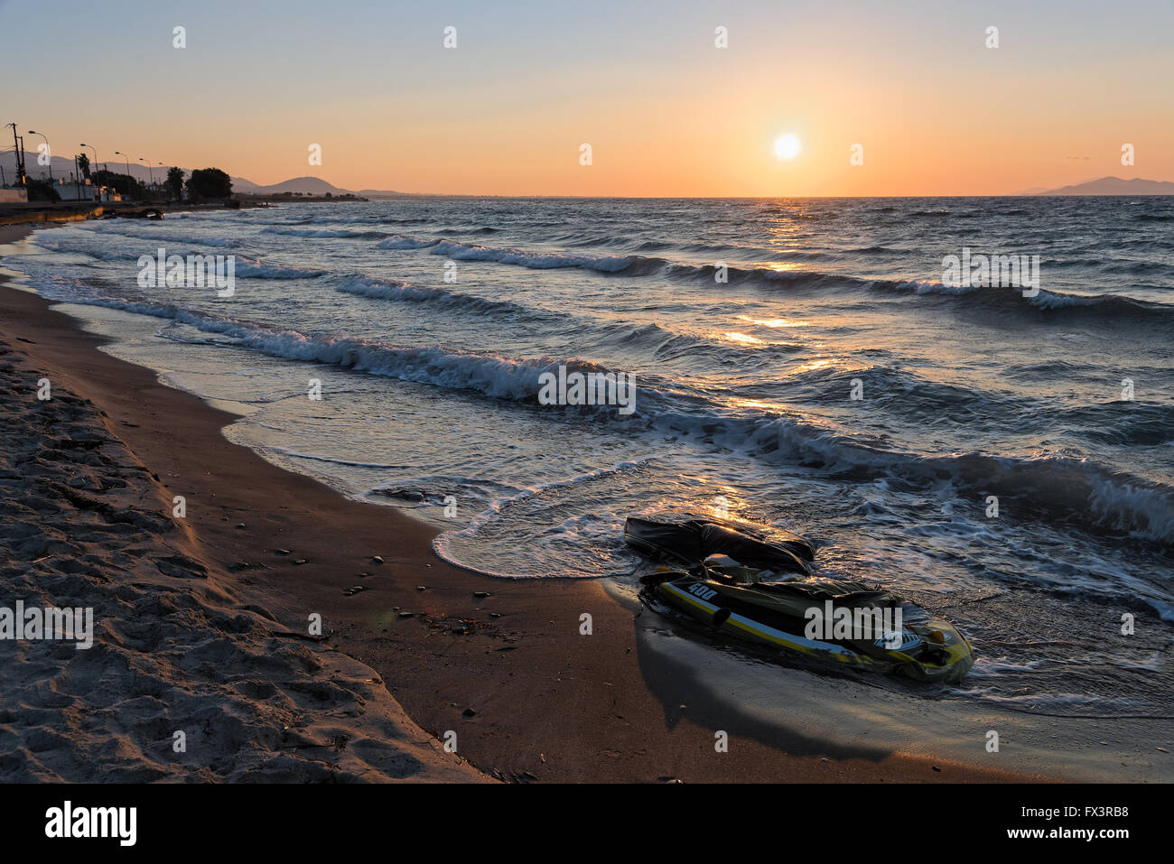 Damaged plastic boat of refugees on October 14, 2015 on a beach of Kos island, Greece. Stock Photo