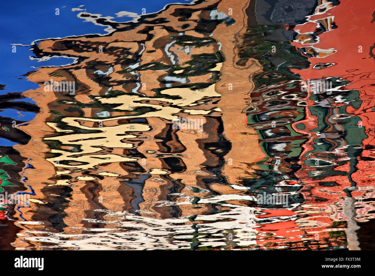 Colorful houses (reversed reflection) of picturesque Murano island, Venice, Veneto, Italy. Stock Photo