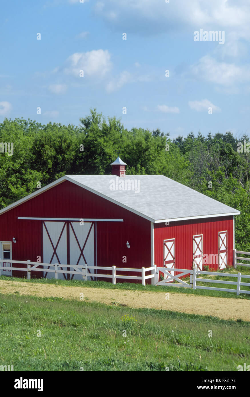 Well-maintained red and white barn with white, wooden fence, near Galena, Ilinois, USA Stock Photo