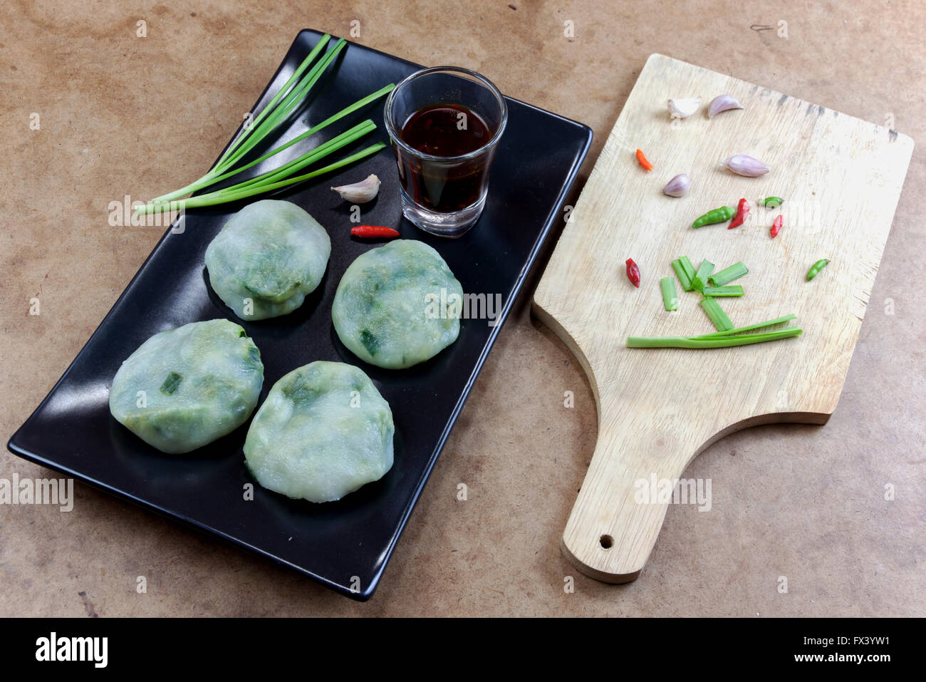 Allium tuberosum. Garlic chives with soy source. Dim sum is chinese cuisine. Stock Photo