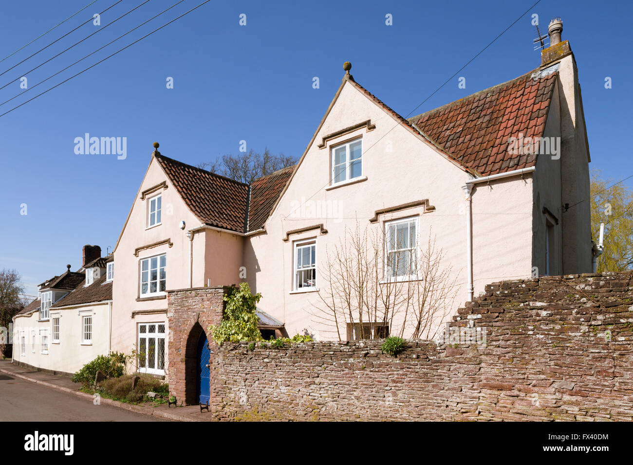 A large 17th-century gabled house in the village of Iron Acton, South Gloucestershire, UK. Stock Photo