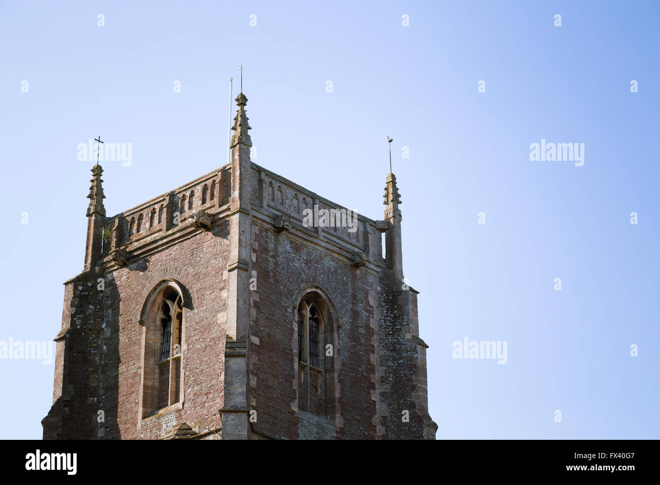 Top of the 1439 tower of St James the Less, a medieval church in the village of Iron Acton, South Gloucestershire. Stock Photo