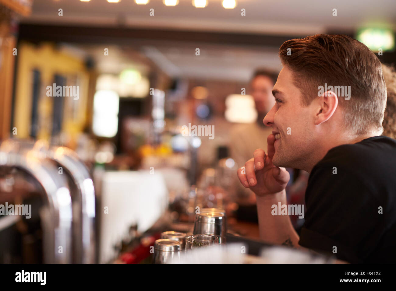 Man sitting at counter hi-res stock photography and images - Alamy