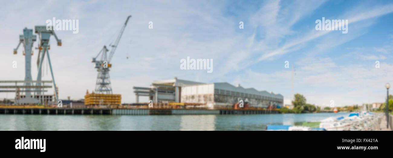 Shipyard crane, blurred. Blur backgrounds concept. Stock Photo