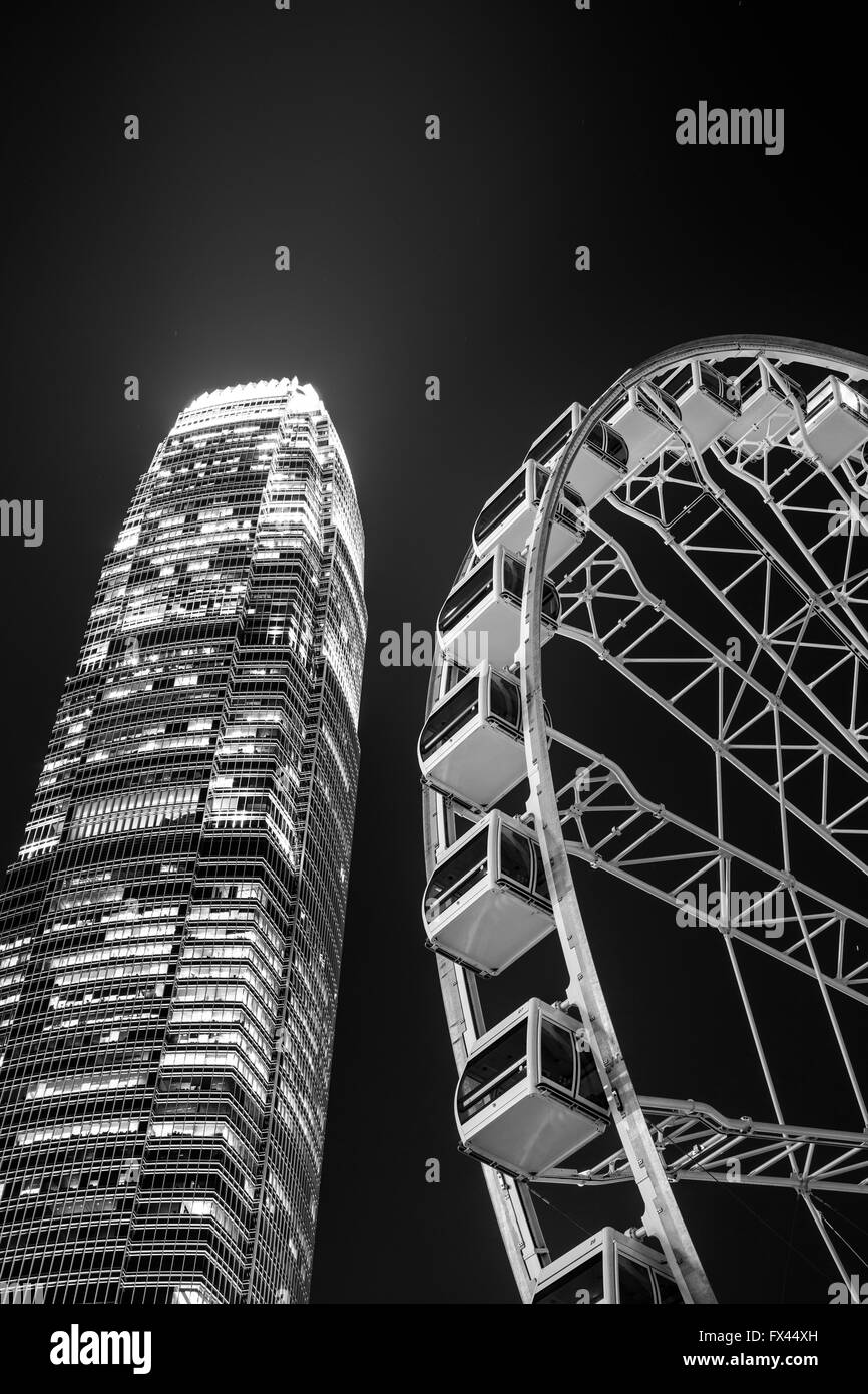 Ferry Wheel  and Modern Commercial building in Hong Kong Stock Photo