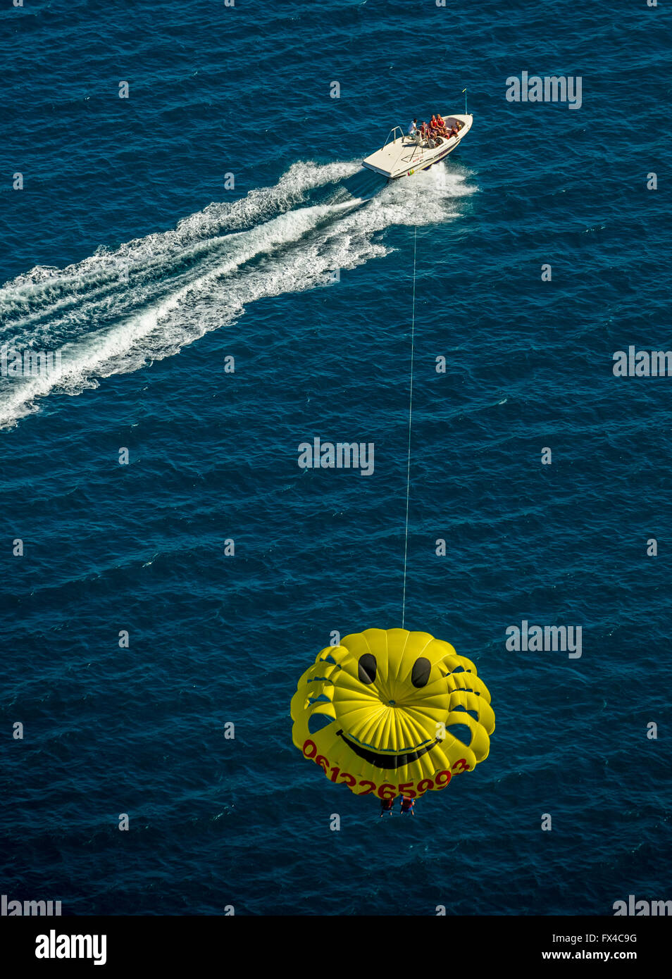 Aerial view, parasailing, parachute with a smiley face drawn by a motor boat, Duo parasailing, Argelès-sur-Mer France Languedoc- Stock Photo