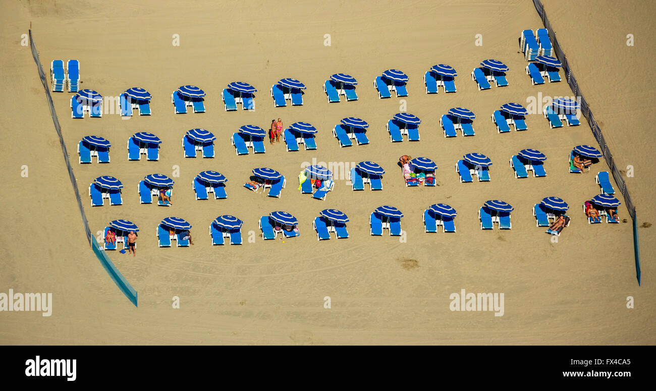 seen aerial, blue beach umbrellas with blue beach chairs, beach chairs on the Mediterranean beach from the aircraft, Stock Photo