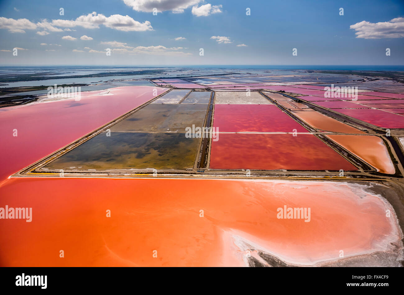 Aerial, salt pans, salt lakes of Aigues-Mortes, Mediterranean coast, Camargue, southern France, Red salt lakes, salt extraction, Stock Photo