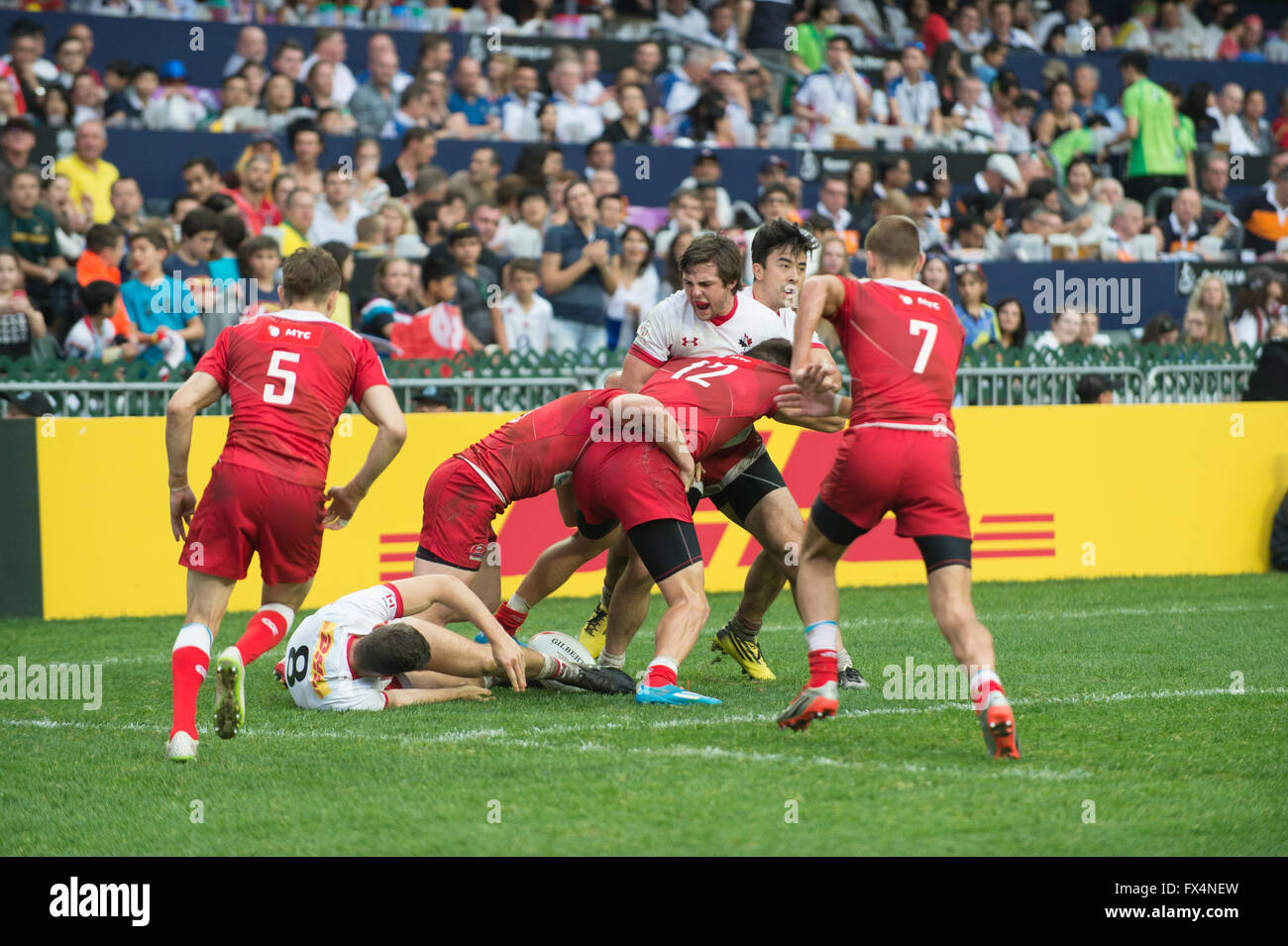 Hong Kong, China. 10, April, 2016. HSBC World Rugby Sevens Series-round 7, Hong Kong Stadium. Russia(red) vs Canada(white) Shield Final. Russia wins 19-14. Credit:  Gerry Rousseau/Alamy Live News Stock Photo