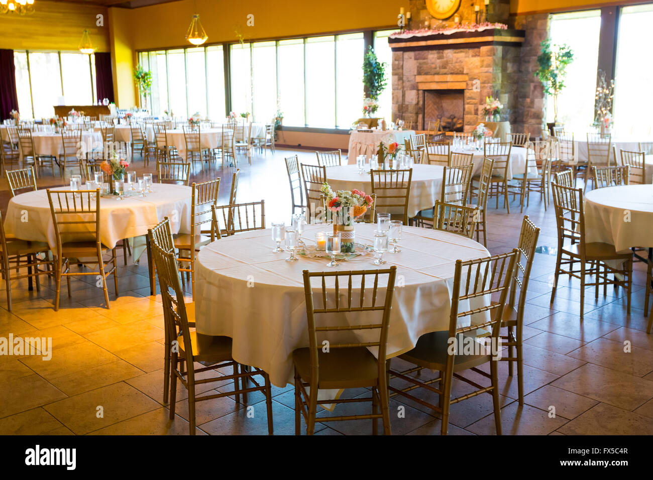 Tables and seating for an indoor wedding reception in a craftsman style