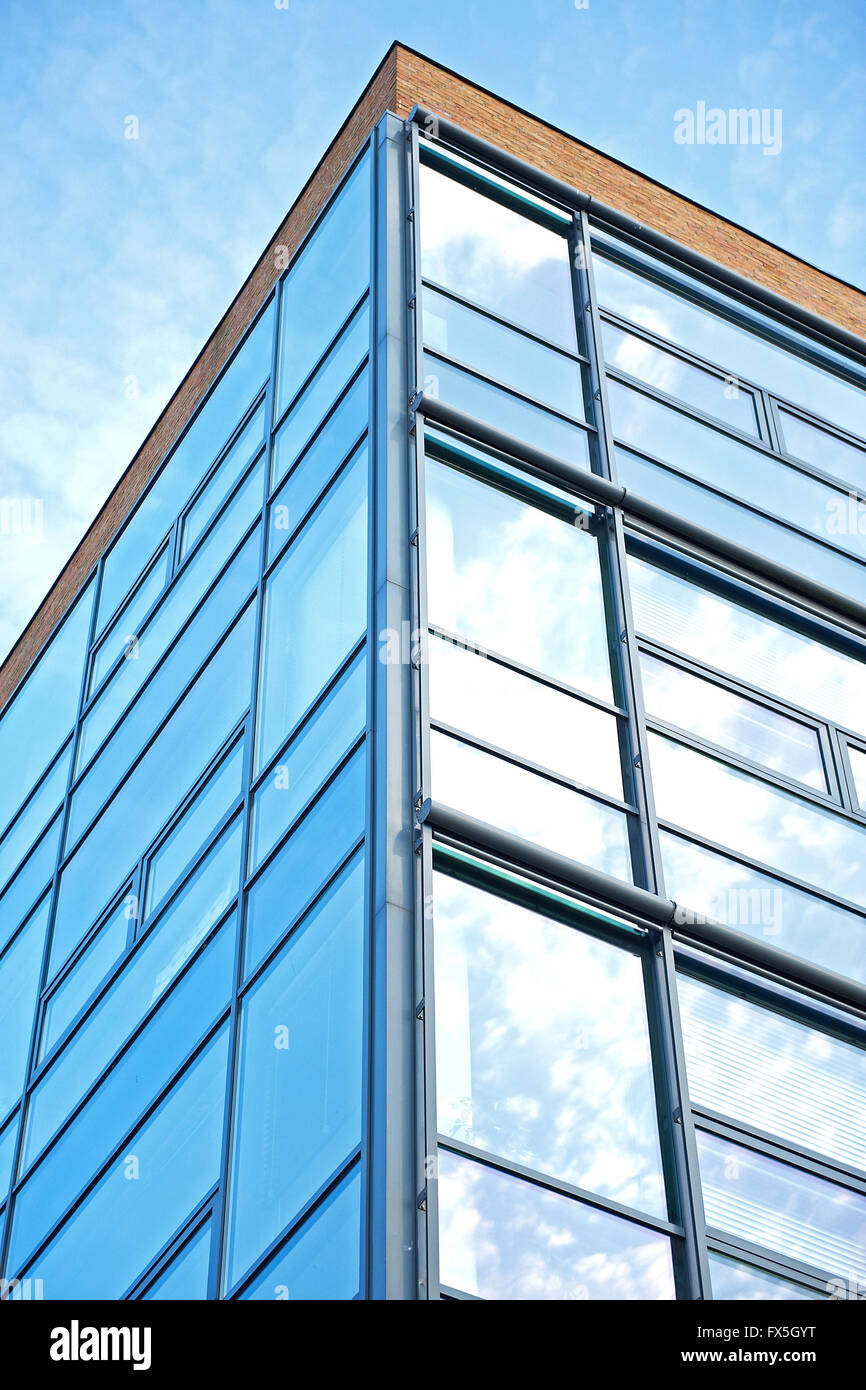 Office building reflecting the blue sky Stock Photo - Alamy