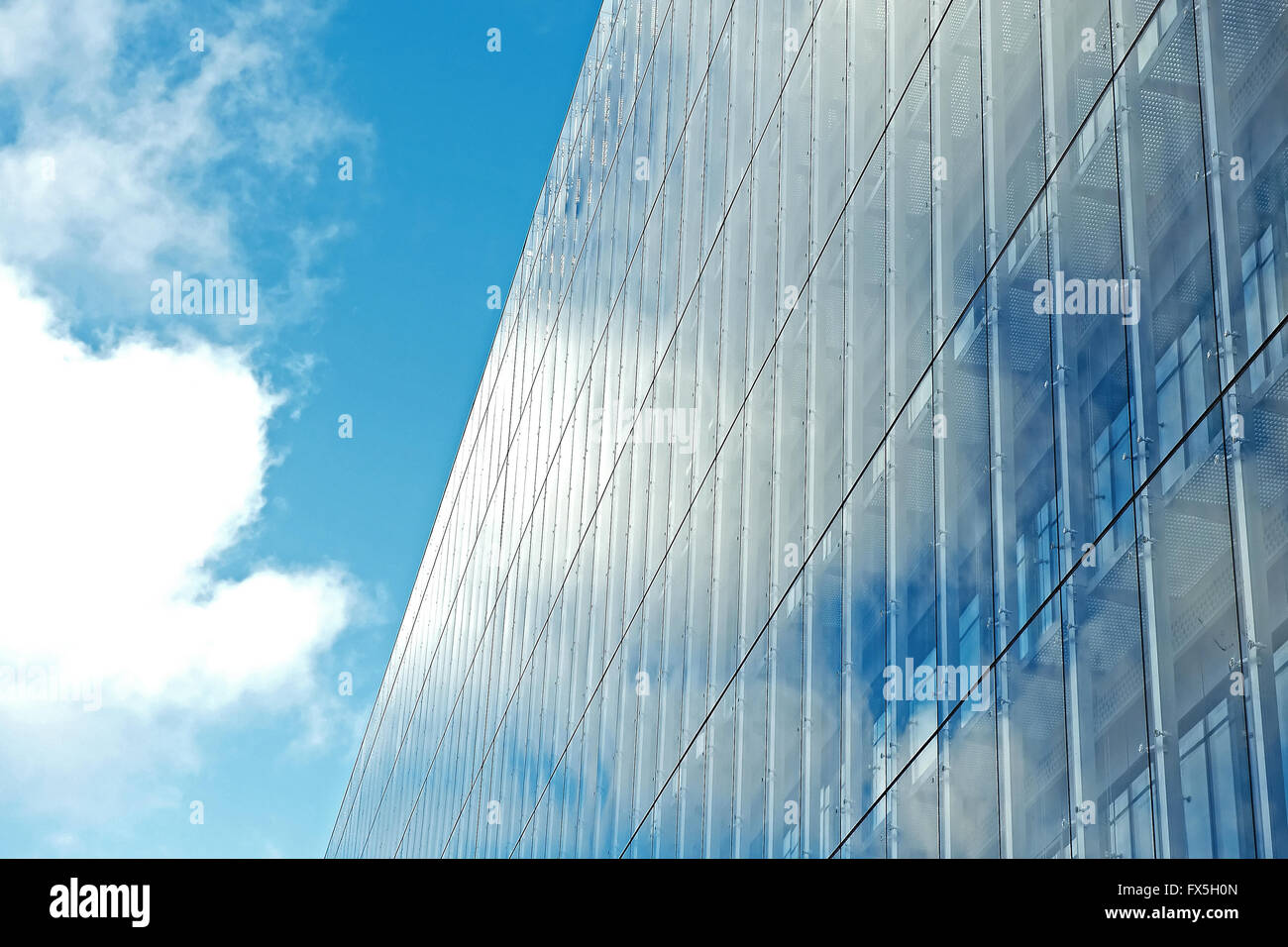 Office building reflecting the blue sky Stock Photo - Alamy