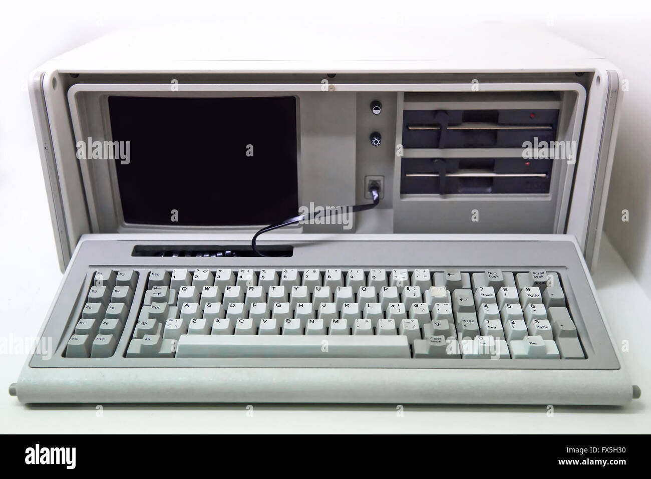 Old white personal computer with floppy disk drives Stock Photo